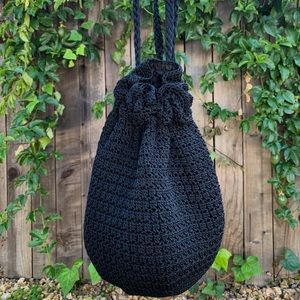 The Sak black pull string backpack